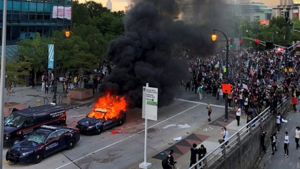 What are the economic consequences of race-related rioting?