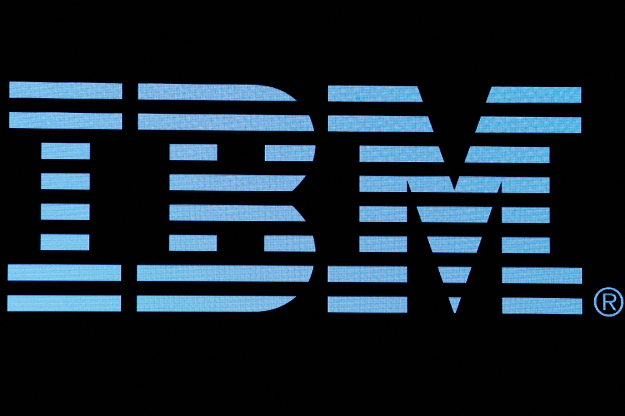 The logo for IBM is displayed on a screen on the floor of the New York Stock Exchange (NYSE) in New York, US