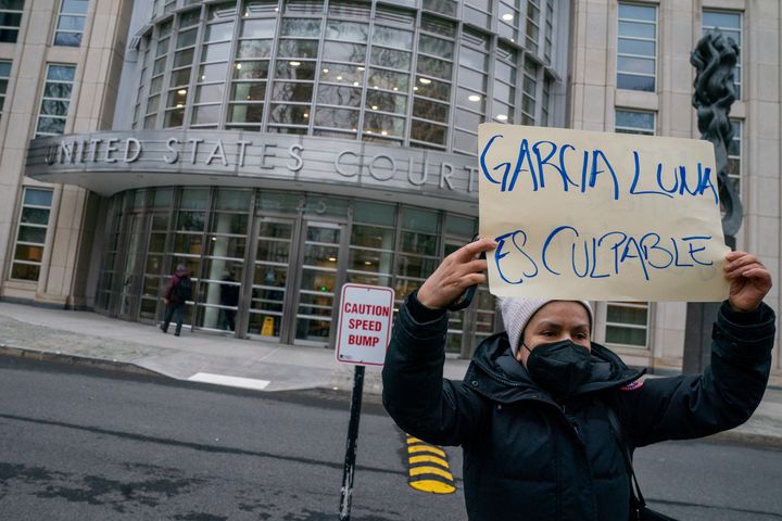 Someone holding a sign outside the court during Genaro Garcia Luna's trial