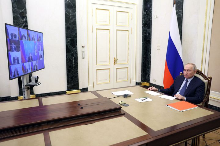 Russian President Vladimir Putin chairs a meeting with members of the UN Security Council