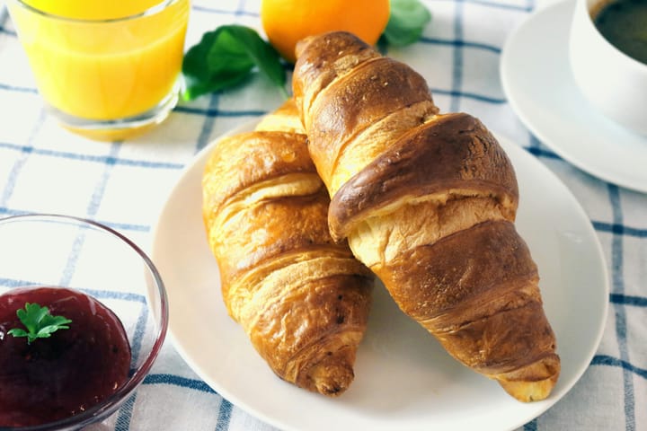 croissants on a plate with jam