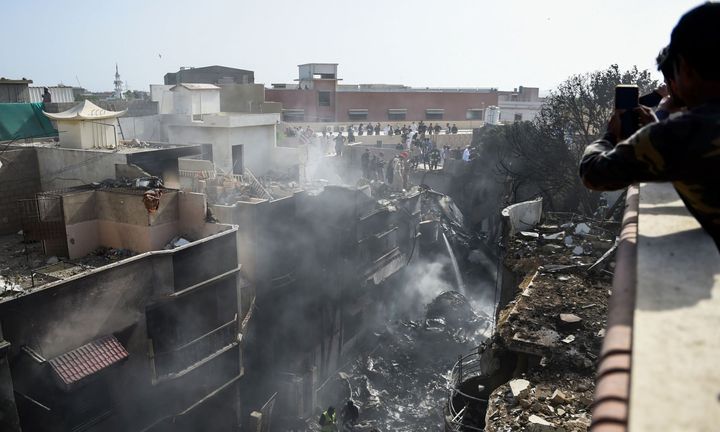 Jetliner carrying 98 people crashes into residential neighborhood in Pakistan